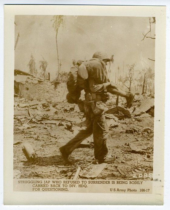 Photo~ Struggling Jap Who Refused to Surrender is Being Carried back 