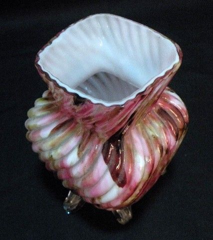 delightful this is a small vase that is square in form it has a white 